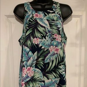Sleeveless top with floral theme. Great for summer. Work or casual